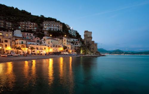 a view of a beach at night with buildings at 'A Regina b&b Cetara in Cetara