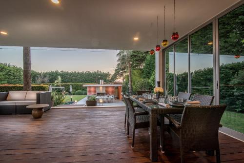 a patio with a table and chairs and a couch at Cascais Casa Laranja Boutique House in Cascais