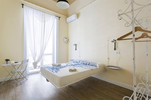 Postel nebo postele na pokoji v ubytování Artisan Maison Palermo