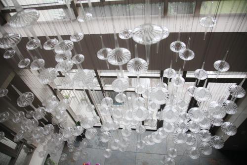 a bunch of chandeliers hanging from a ceiling at Micasa Hotel in Taichung