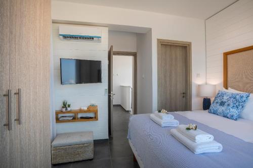 Ένα ή περισσότερα κρεβάτια σε δωμάτιο στο Chris Le Mare Luxury Villa