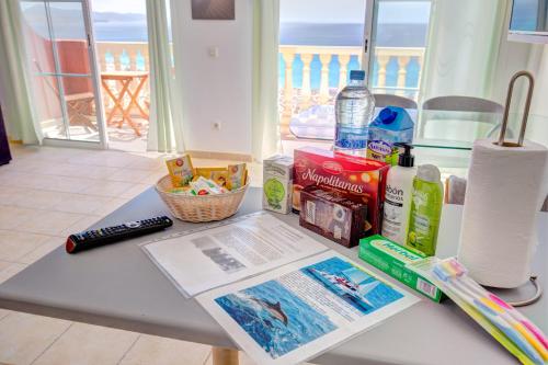 a table with a book and other items on it at Your Ocean Suite in Costa Calma