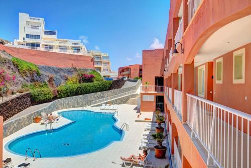 a view of a swimming pool on the side of a building at Your Ocean Suite in Costa Calma