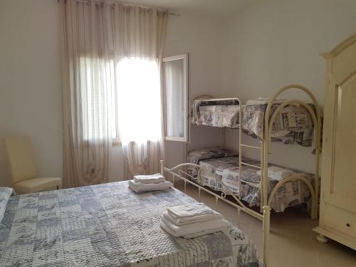 Postel nebo postele na pokoji v ubytování B&b Giadà