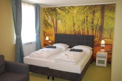 Кровать или кровати в номере CASILINO Hotel A 20 Wismar