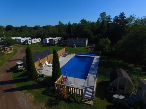 an aerial view of a backyard with a swimming pool at Orchard Queen Motel & Rv Park in Middleton