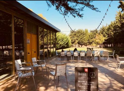 a group of chairs and tables outside of a building at Hotel Restaurante El Valles 4 ESTRELLAS in Briviesca