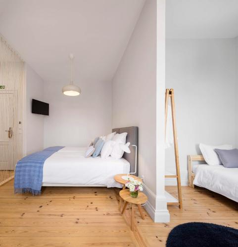 Postel nebo postele na pokoji v ubytování Penedo da Saudade Suites & Hostel