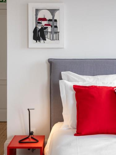 Postel nebo postele na pokoji v ubytování Penedo da Saudade Suites & Hostel
