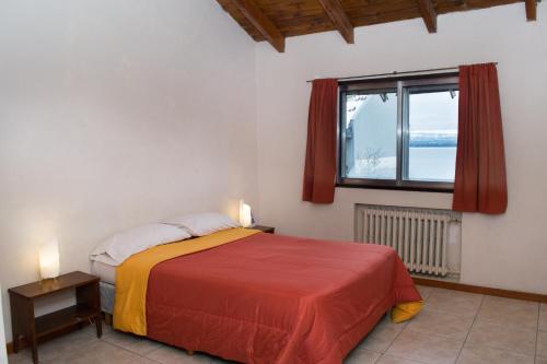Ein Bett oder Betten in einem Zimmer der Unterkunft Hostel Inn Bariloche