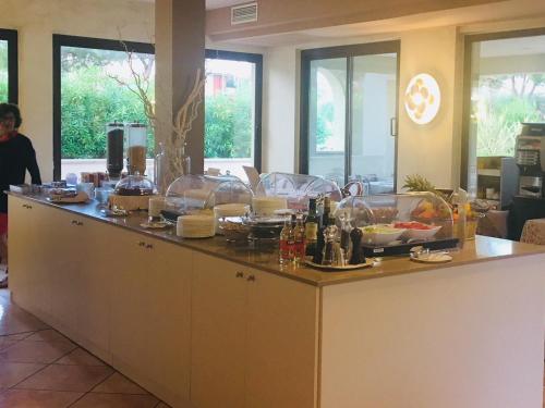 a kitchen with a lot of counter space at Hotel Porto Azzurro in Sirmione