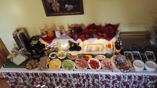 a table with a buffet of different types of food at Willa u Zwijaczy in Zakopane