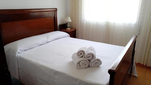 A bed or beds in a room at La Caseta del Pitxo