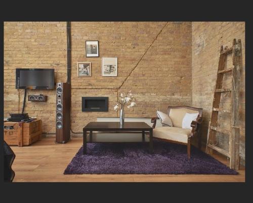 a living room with a couch and a coffee table at Budapest Loft Central Design Home in Budapest