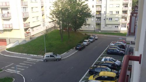 a group of cars parked in a parking lot at Apartment Andjela in Belgrade