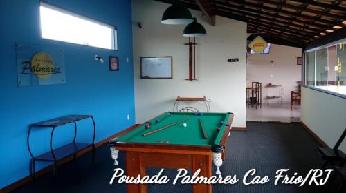 a billiard room with a pool table in it at Pousada Palmares in Cabo Frio