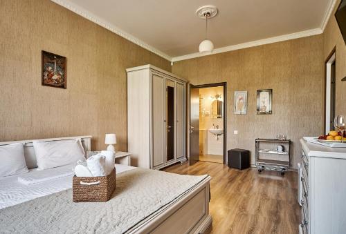 a large bedroom with a bed and a bathroom at Hotel Fusion in Odesa