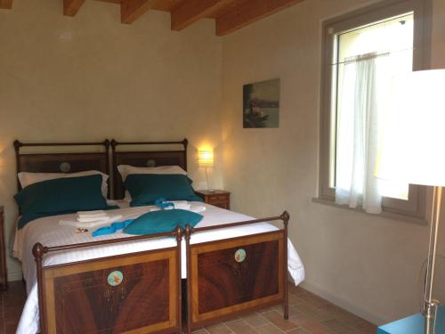 Cama o camas de una habitación en L'Isolo b&b e case vacanza