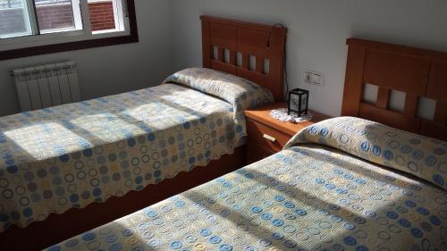 Cama ou camas em um quarto em Apartamento O pombal