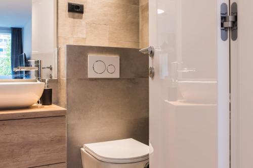 a bathroom with a toilet and a sink at BCAdria apartments in Split