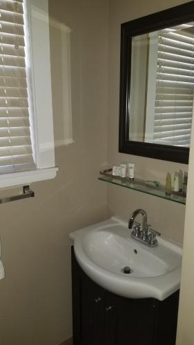a bathroom with a sink and a mirror at Gondola Lodge & Tahoe Beach Club in South Lake Tahoe