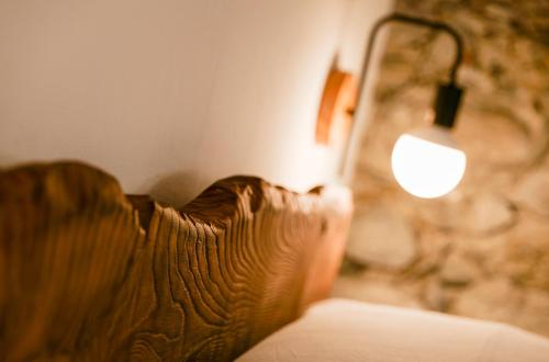 a close up of a couch next to a lamp at Palazzo Giani in Chiavenna