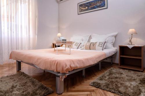 Guesthouse Wish tesisinde bir odada yatak veya yataklar