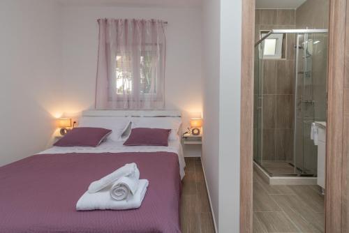 Posteľ alebo postele v izbe v ubytovaní Apartman Niksi