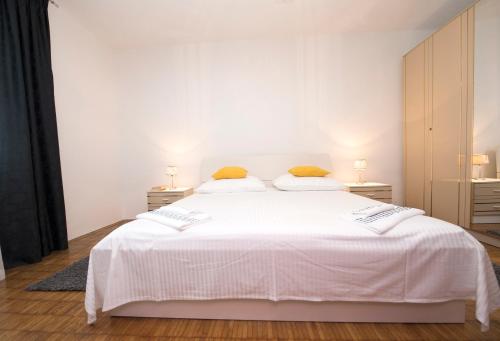 Postel nebo postele na pokoji v ubytování Apartment D&A
