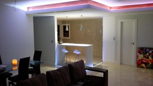a living room with a couch and a table at centro / internet / parking / aire acondicionado in Elche