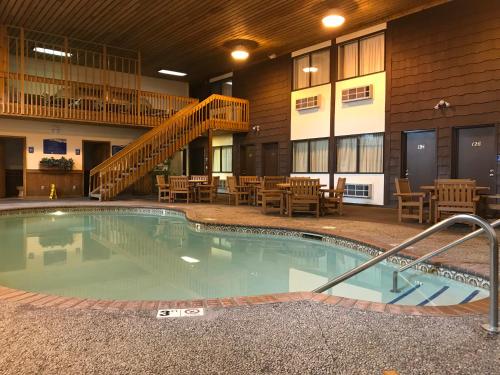 a large swimming pool in the middle of a building at Superior Inn in Superior