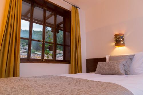 Ein Bett oder Betten in einem Zimmer der Unterkunft Hotel Rumi Punku