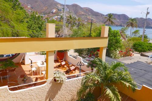 a balcony of a house with a view of the ocean at Casa D'mer Taganga in Taganga