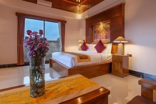 Postel nebo postele na pokoji v ubytování Uma Galih Ubud Villa