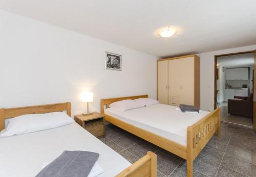Postel nebo postele na pokoji v ubytování Apartments Crystal