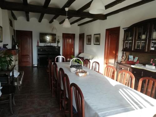 a dining room with a large table and chairs at Agroturismo Pagoederraga in Orio