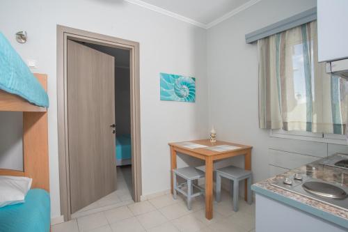a bathroom with a small table and a sink at Melissi in Lefkada Town
