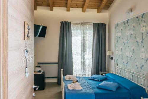 En eller flere senge i et værelse på Valle dei Mulini - Lake Como