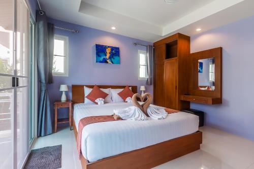 Thuan Resort tesisinde bir odada yatak veya yataklar