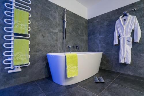 a bathroom with a bath tub in a room at Sporthotel Cinderella in Obertauern