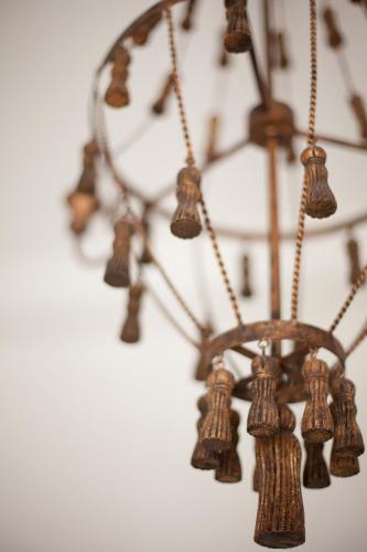a close up of a chandelier with wooden objects at Quartara Boutique Hotel in Panarea