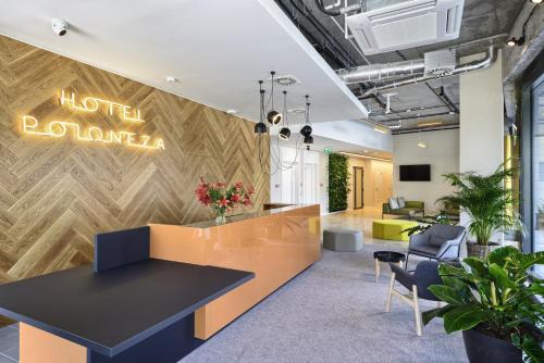 an office lobby with a hotel rovo sign on the wall at Arche Hotel Poloneza in Warsaw