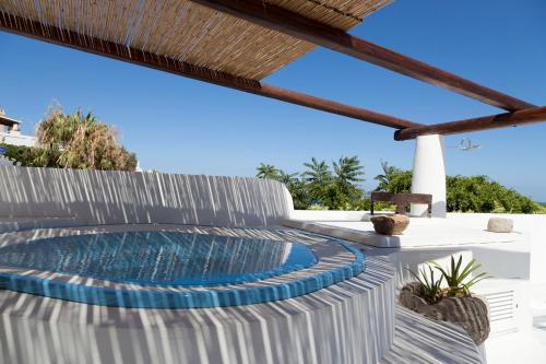 a swimming pool on the patio of a house at Quartara Boutique Hotel in Panarea