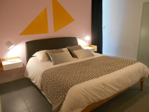 Postel nebo postele na pokoji v ubytování Maison d'Hotes Les Palmiers