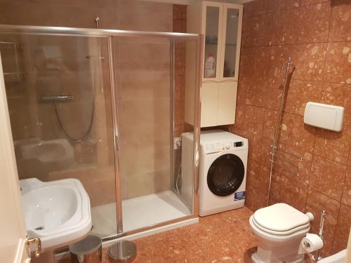 a bathroom with a shower and a toilet and a sink at Camilla apartment in Venice-Molino in Venice