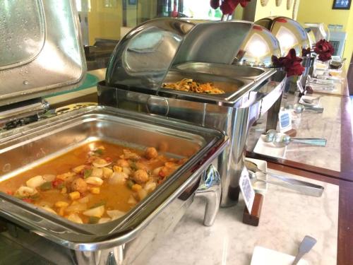 a buffet line with a lot of food at Vinh Hung Old Town Hotel in Hoi An