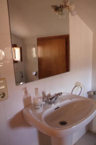 
a bathroom with a sink and a mirror at Allucant - Gallocanta in Gallocanta
