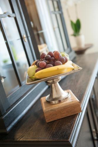 a plate of fruit sitting on a table at Pension Amthof in Oberderdingen