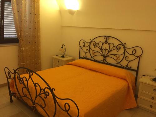 Postel nebo postele na pokoji v ubytování I trulli di nonna Rosa