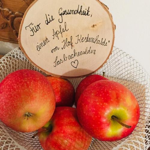 a bowl of apples with a sign on top at Hotel Restaurant Der Engel, Sasbachwalden in Sasbachwalden